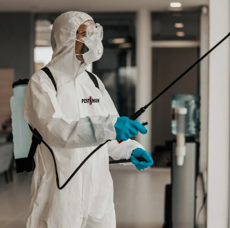 PestMan technician carrying out a fogging treatment in a Dubai residential lobby